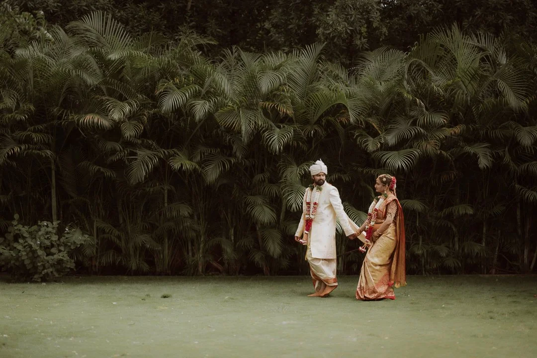 A couple walking together in a garden