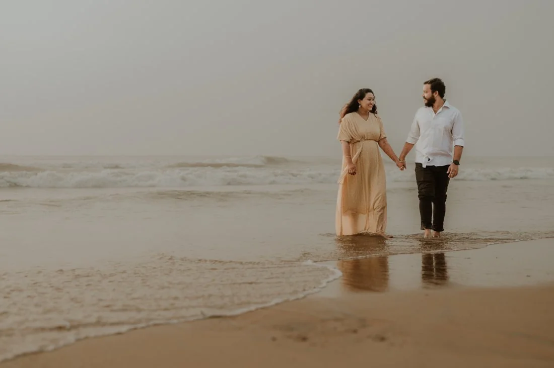 Two people together beside the sea
