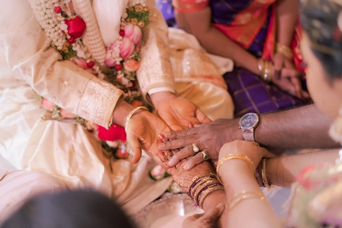 Hands joining during a wedding ceremony